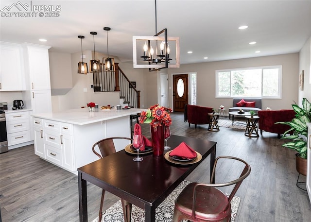 1021 Pioneer Ln, Colorado Springs, CO 80904 - dining area featuring stairway, a chandelier, wood finished floors, and recessed lighting