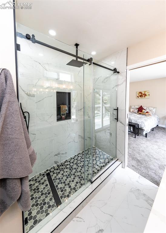 1021 Pioneer Ln, Colorado Springs, CO 80904 - ensuite bathroom with a marble finish shower, recessed lighting, and marble finish flooring