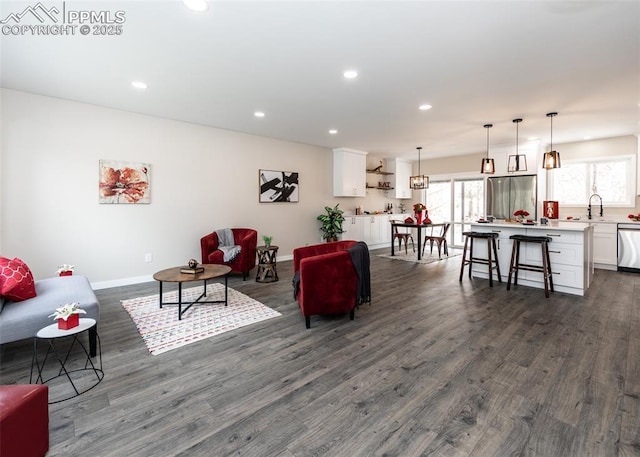 1021 Pioneer Ln, Colorado Springs, CO 80904 - living area with dark wood-type flooring, healthy amount of natural light, recessed lighting, and baseboards