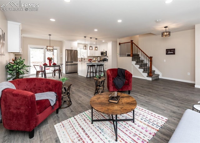 1021 Pioneer Ln, Colorado Springs, CO 80904 - living room featuring dark wood-style flooring, baseboards, stairway, and recessed lighting