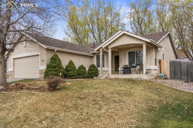 view of front of home with stone siding, fence, a garage, a front lawn, and stucco siding