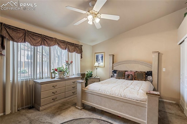 bedroom featuring baseboards, vaulted ceiling, carpet flooring, and a ceiling fan