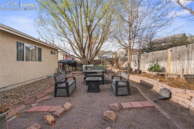 view of patio with a fenced backyard and an outdoor living space