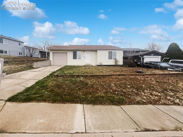 ranch-style house with driveway and an attached garage
