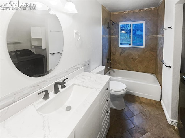 full bathroom with toilet, stone finish flooring, vanity, and shower / bathtub combination