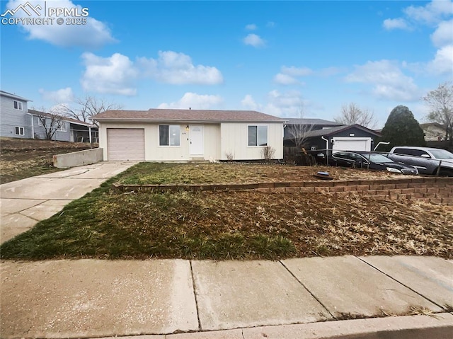 ranch-style house featuring driveway and a garage