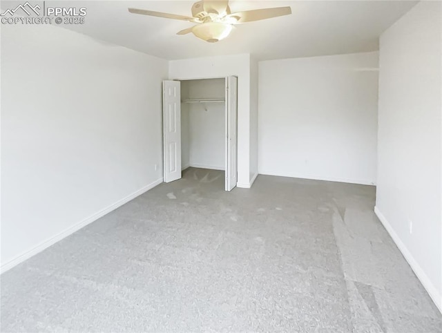 unfurnished bedroom with baseboards, ceiling fan, and a closet