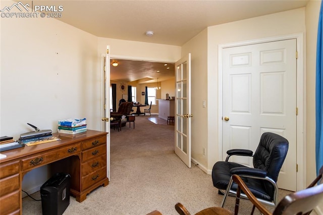 home office with french doors, light colored carpet, and baseboards