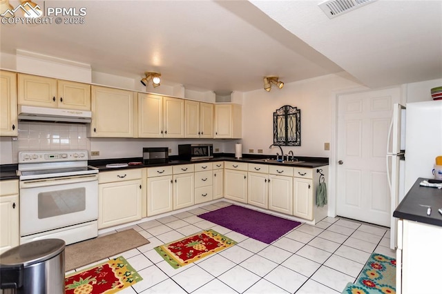 kitchen featuring white range with electric stovetop, under cabinet range hood, dark countertops, and light tile patterned flooring