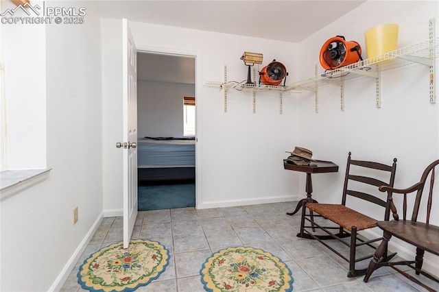 spacious closet featuring light tile patterned floors