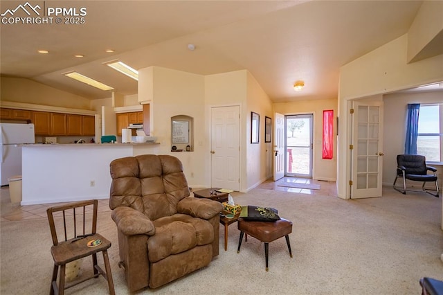 living area with light carpet, plenty of natural light, recessed lighting, and lofted ceiling