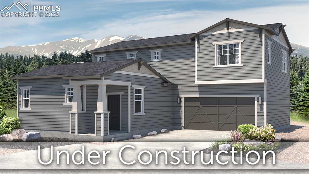 10208 Spry St, Colorado Springs, CO 80924 - view of front of house with concrete driveway, a porch, a mountain view, and an attached garage