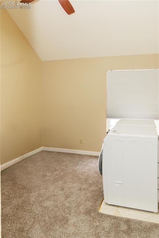 interior space featuring light colored carpet, laundry area, washer / dryer, and baseboards