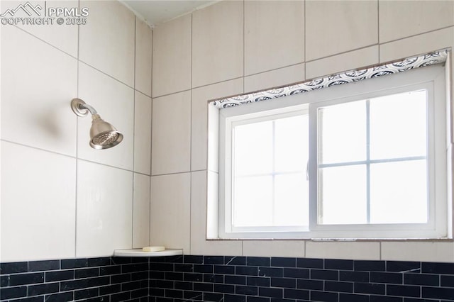 interior details with a tile shower