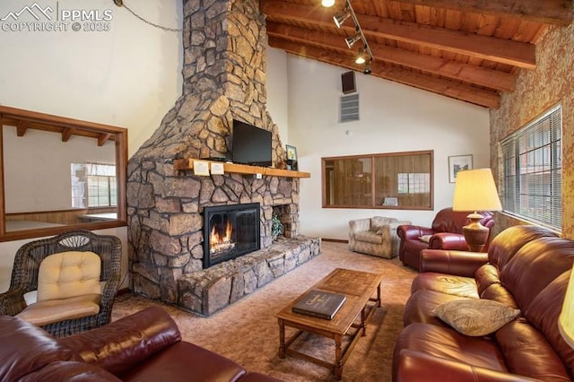 living room with wood ceiling, a stone fireplace, high vaulted ceiling, beamed ceiling, and carpet