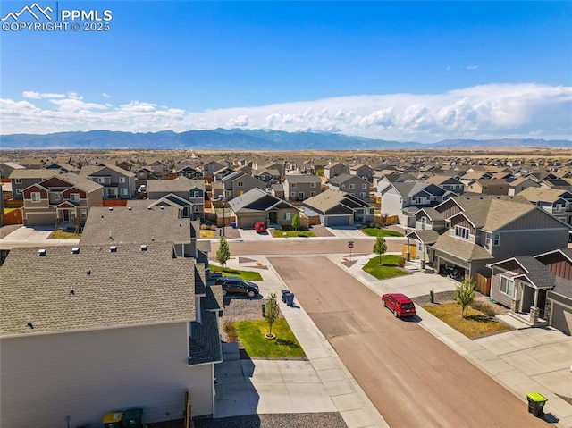 bird's eye view with a mountain view and a residential view