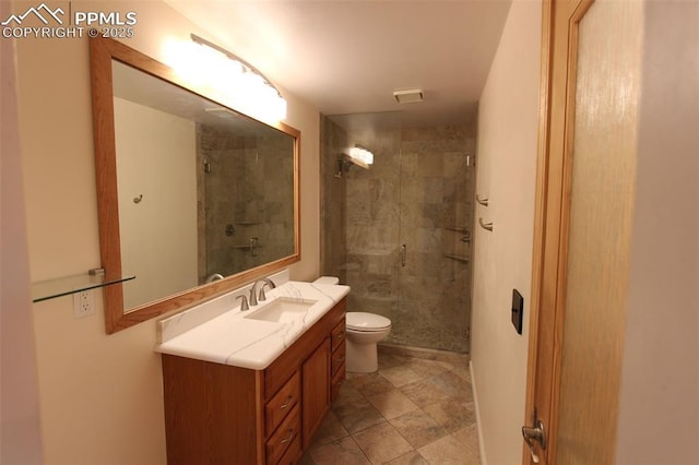 2380 Stepping Stones Way, Colorado Springs, CO 80904 - bathroom featuring a shower stall, visible vents, toilet, and vanity