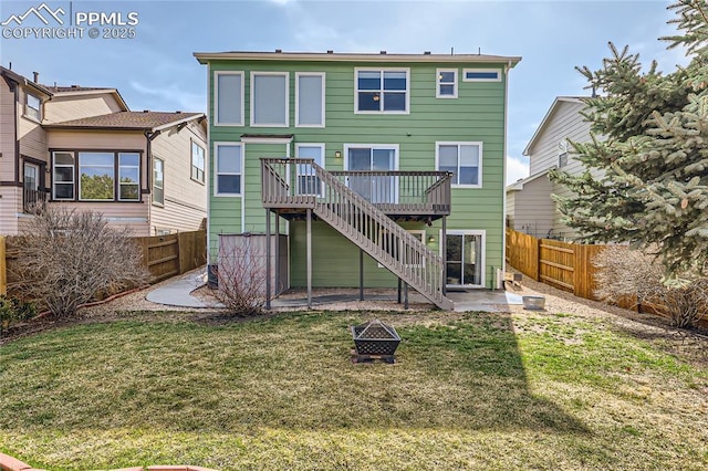rear view of house featuring stairway, a patio, a fenced backyard, a deck, and a lawn