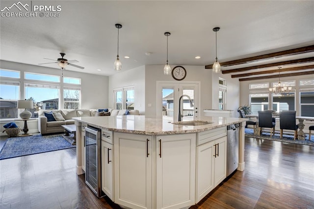 kitchen featuring dark wood-style flooring, a sink, beverage cooler, and recessed lighting
