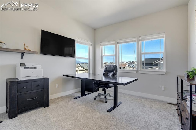 home office with baseboards, visible vents, and carpet floors