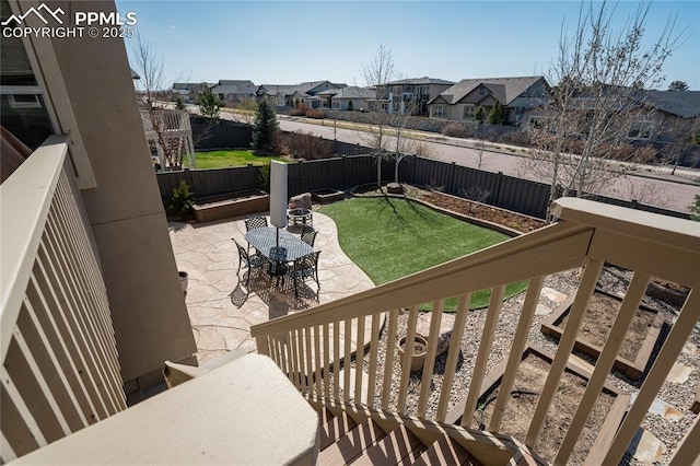 exterior space featuring a residential view and a fenced backyard