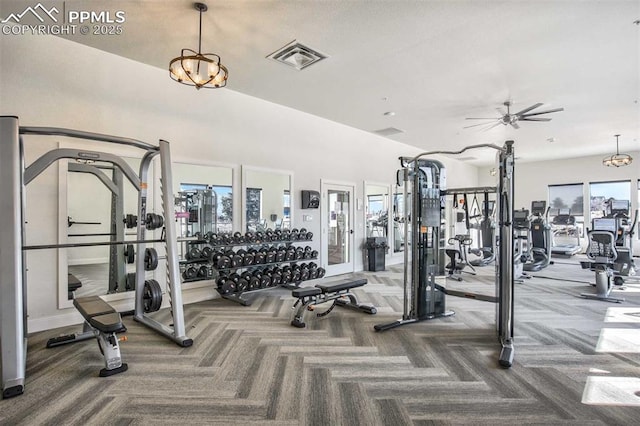 gym with carpet flooring, visible vents, and a ceiling fan