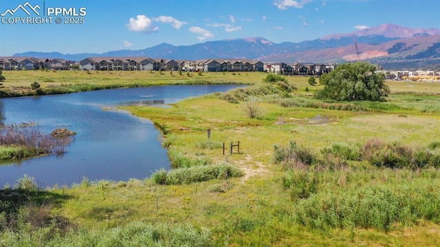 water view with a mountain view and a residential view