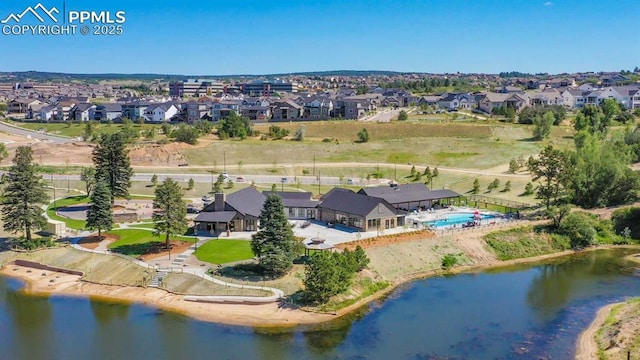 aerial view with a residential view and a water view