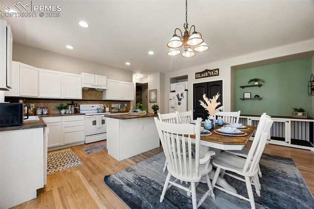 4454 College Park Ct, Colorado Springs, CO 80918 - dining area featuring an inviting chandelier, recessed lighting, and light wood-type flooring