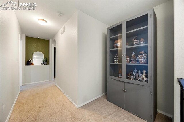 4454 College Park Ct, Colorado Springs, CO 80918 - hall with baseboards, visible vents, and carpet flooring