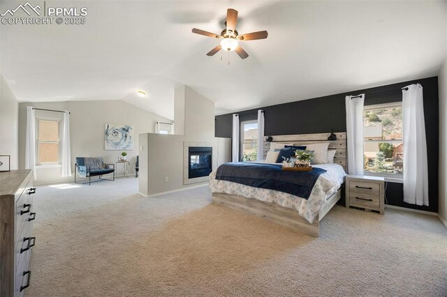 4454 College Park Ct, Colorado Springs, CO 80918 - bedroom featuring multiple windows, light carpet, lofted ceiling, and a fireplace