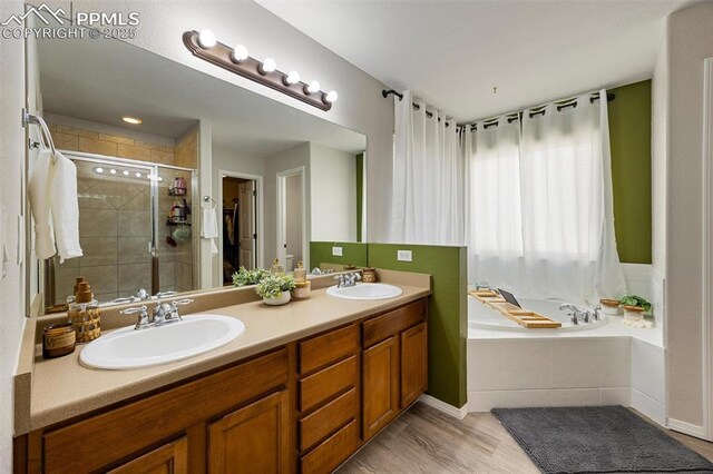 4454 College Park Ct, Colorado Springs, CO 80918 - full bathroom with a bath, double vanity, a sink, and a shower stall