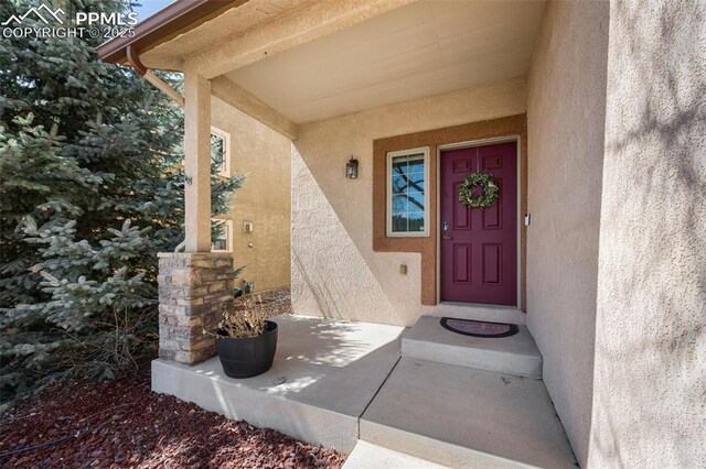 4454 College Park Ct, Colorado Springs, CO 80918 - property entrance with stucco siding