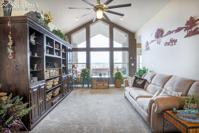 17035 Herring Rd, Colorado Springs, CO 80908 - living area featuring ceiling fan, high vaulted ceiling, and light colored carpet