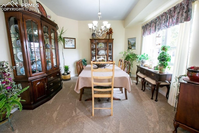 17035 Herring Rd, Colorado Springs, CO 80908 - dining room with baseboards, carpet flooring, and an inviting chandelier