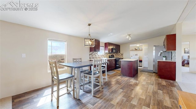 17180 Hanover Rd, Colorado Springs, CO 80928 - dining room with lofted ceiling and wood finished floors
