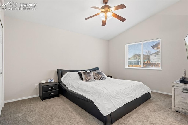bedroom featuring lofted ceiling, carpet flooring, baseboards, and ceiling fan
