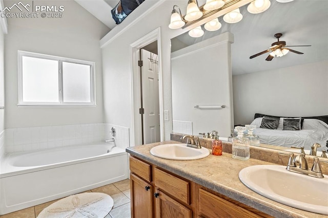 bathroom with vaulted ceiling, a garden tub, tile patterned flooring, and a sink