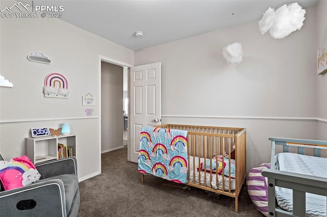 carpeted bedroom featuring baseboards
