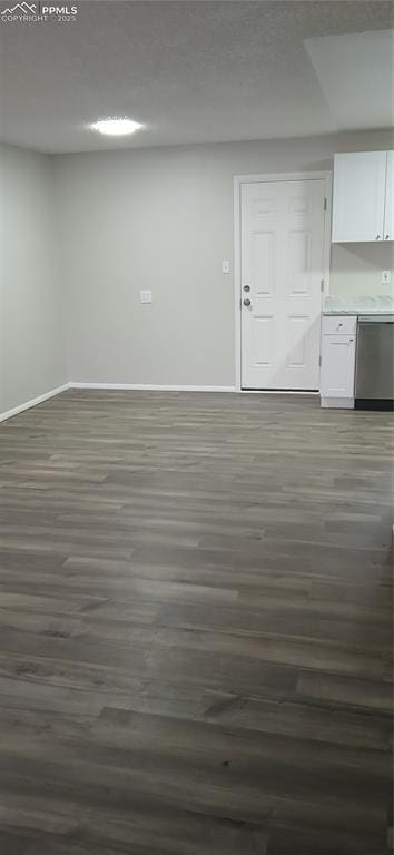 131 Hayes Dr, Colorado Springs, CO 80911 - spare room with baseboards and dark wood-style floors