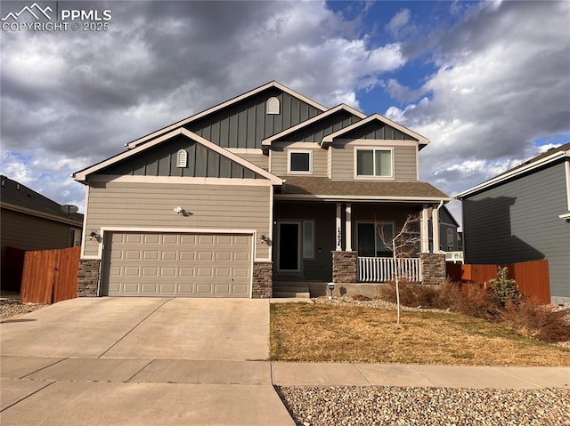 13424 Stone Valley Dr, Peyton, CO 80831 - craftsman house featuring driveway, board and batten siding, stone siding, a porch, and fence