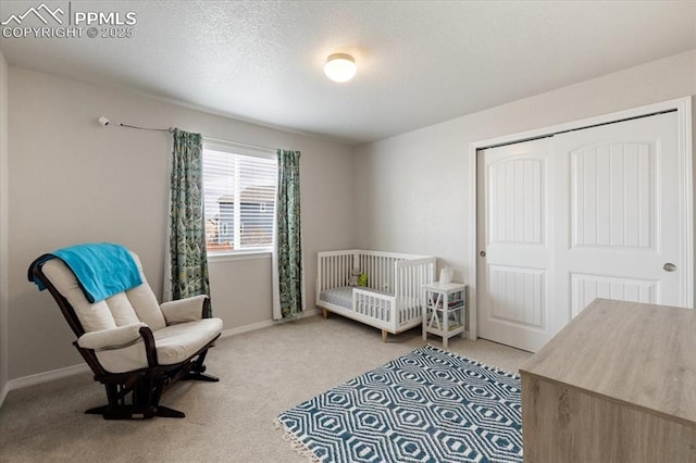 13424 Stone Valley Dr, Peyton, CO 80831 - bedroom with light carpet, a crib, a closet, and baseboards