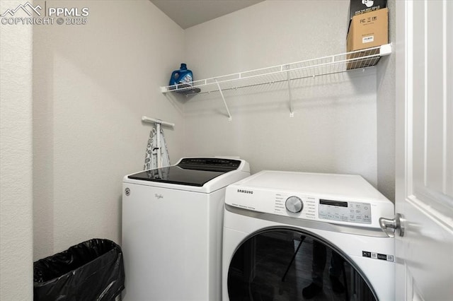 13424 Stone Valley Dr, Peyton, CO 80831 - laundry area with washer and clothes dryer and laundry area