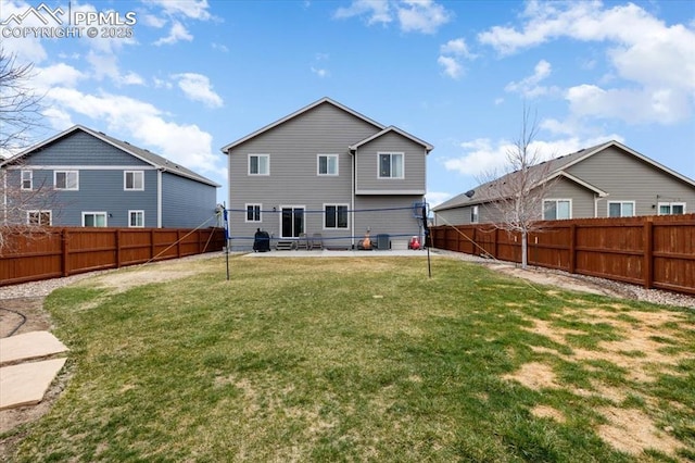 13424 Stone Valley Dr, Peyton, CO 80831 - rear view of house with a patio area, a fenced backyard, and a lawn