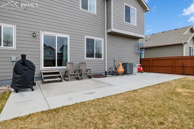 13424 Stone Valley Dr, Peyton, CO 80831 - back of property with central AC, fence, a yard, and a patio