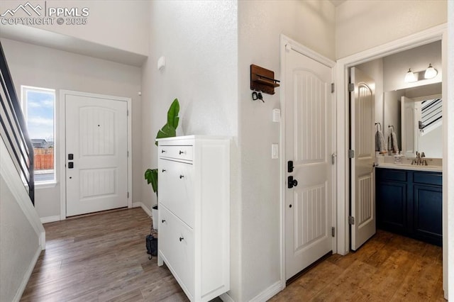 13424 Stone Valley Dr, Peyton, CO 80831 - hall with baseboards and light wood-style floors