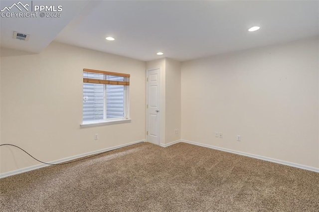 spare room featuring baseboards, carpet floors, visible vents, and recessed lighting