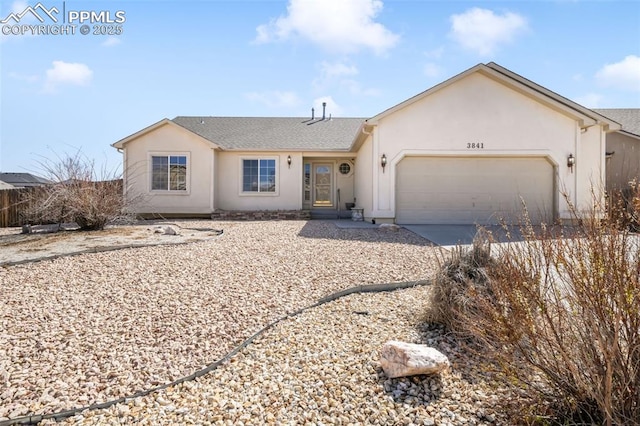 3841 Sonoran Dr, Colorado Springs, CO 80922 - ranch-style home featuring concrete driveway, an attached garage, stucco siding, and a shingled roof