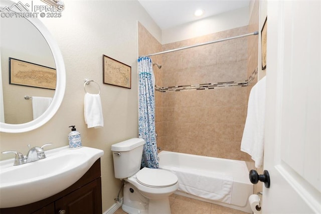 full bath with tile patterned flooring, shower / tub combo with curtain, toilet, and vanity