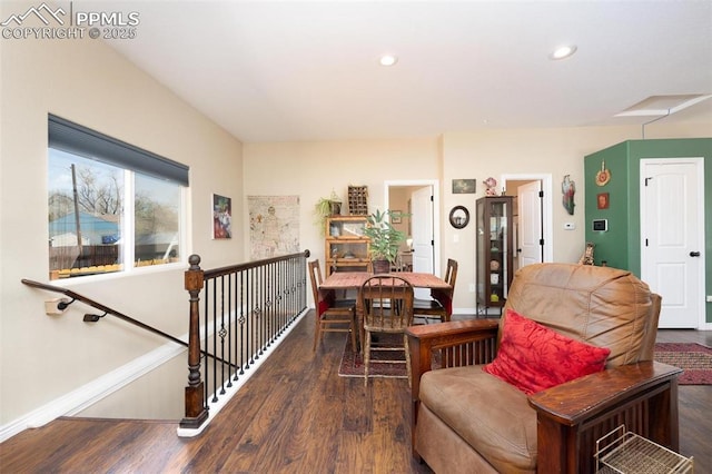 dining room with baseboards, wood finished floors, and recessed lighting